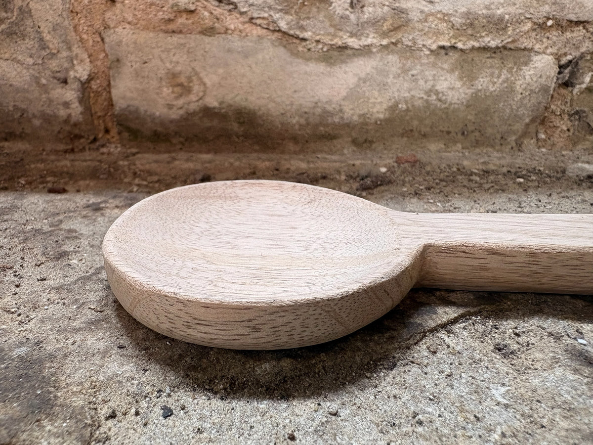 A Hand-Carved Mango Wood Spoon
