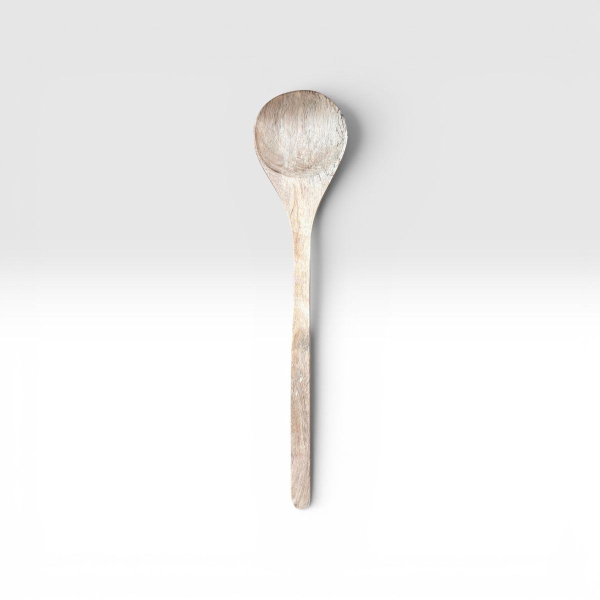 A Hand-Carved Mango Wood Serving Spoon