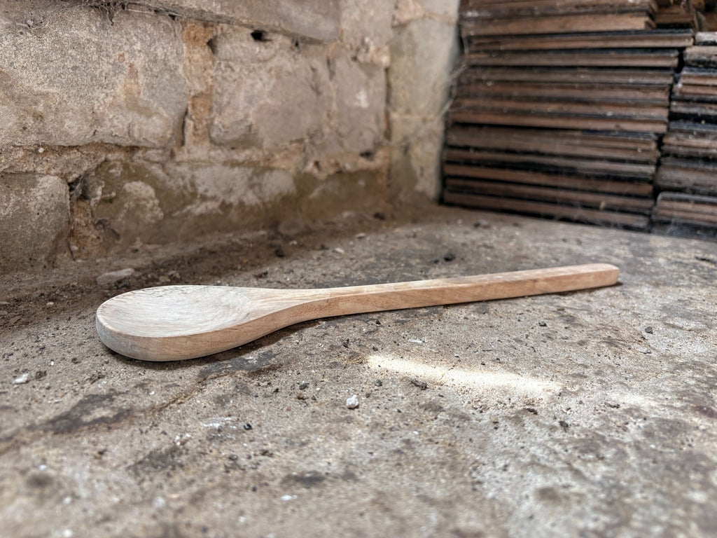 A Hand-Carved Mango Wood Serving Spoon
