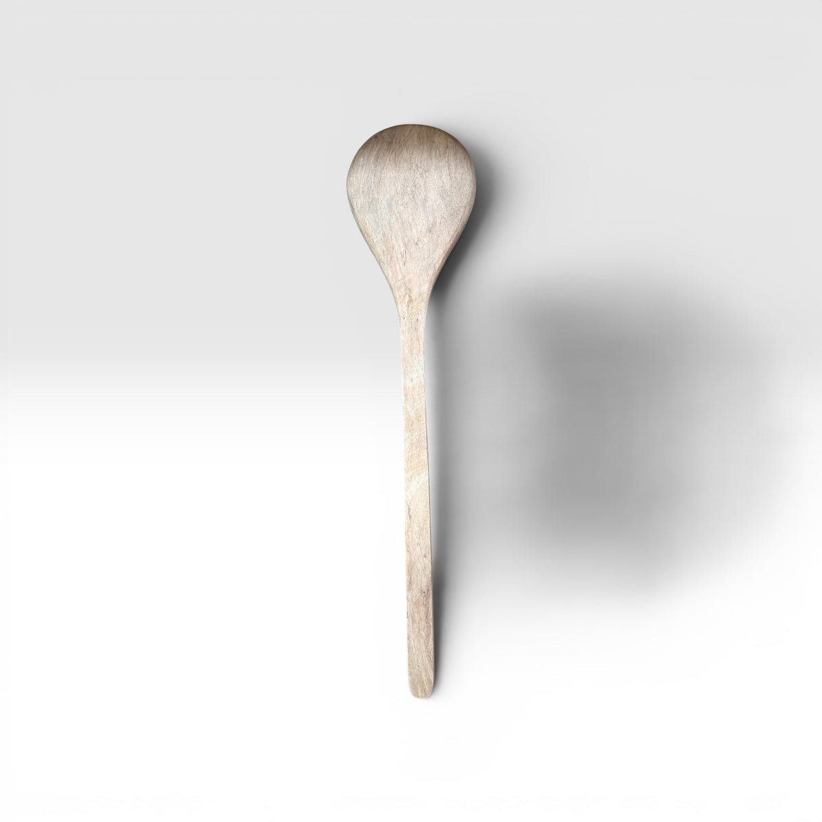A Hand-Carved Mango Wood Serving Spoon