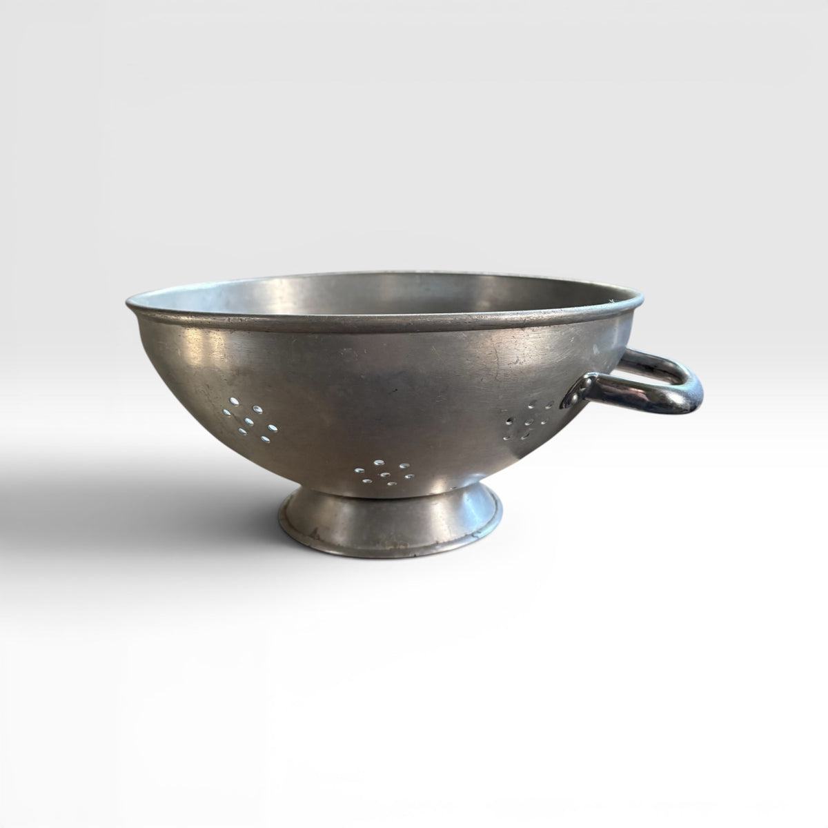 A Large Vintage Metal Colander with Twin Handles